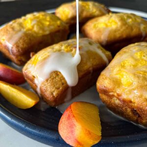 8 mini loaf pan recipe for peach mini loaves with Lemon Icing Glaze Sip Bite Go