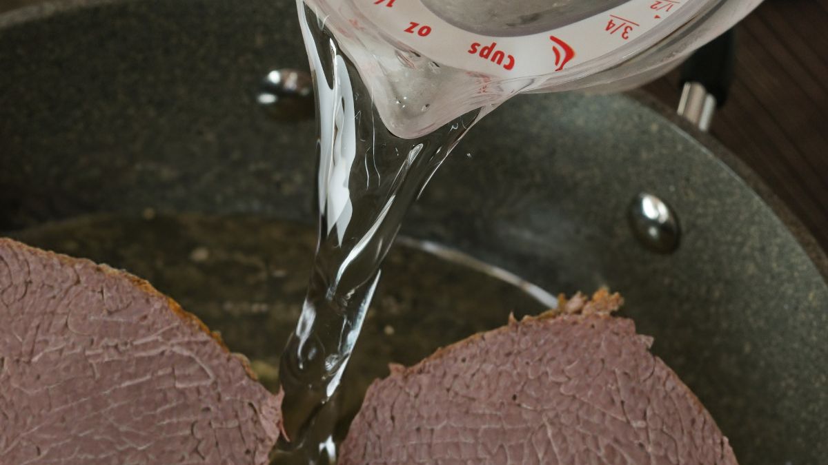 Adding Liquid to the Cooking Pot with tough corned beef