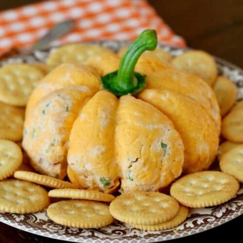 Easy Pumpkin Shaped Cheeseball on a serving plate 1024x683 1