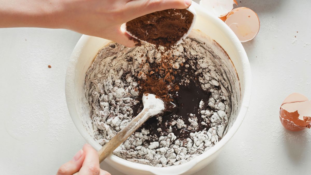 Fixing brownie batter with too much butter by adding flour and cocoa