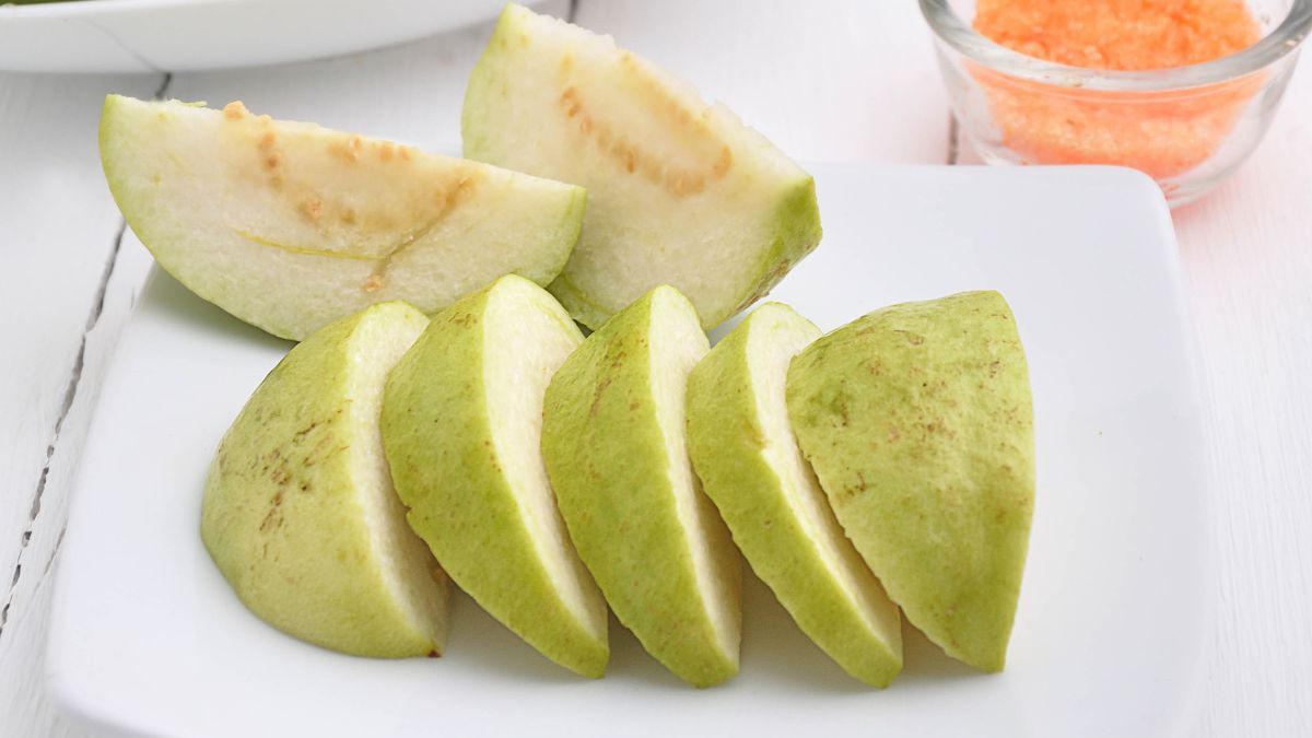 Gray guava sliced served on a white plate