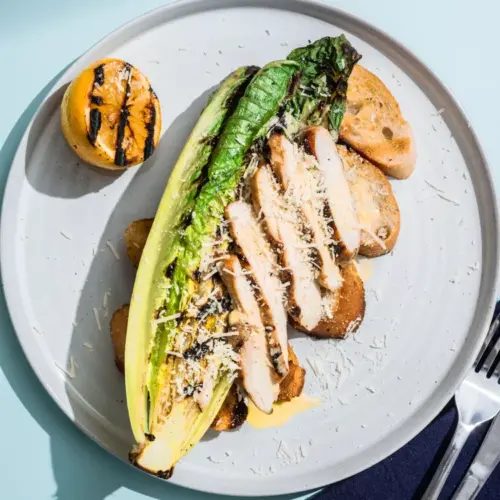 Grilled Chicken Caesar Salad hero 02 faaf7dd338624b6e84ff3c6df08abc45