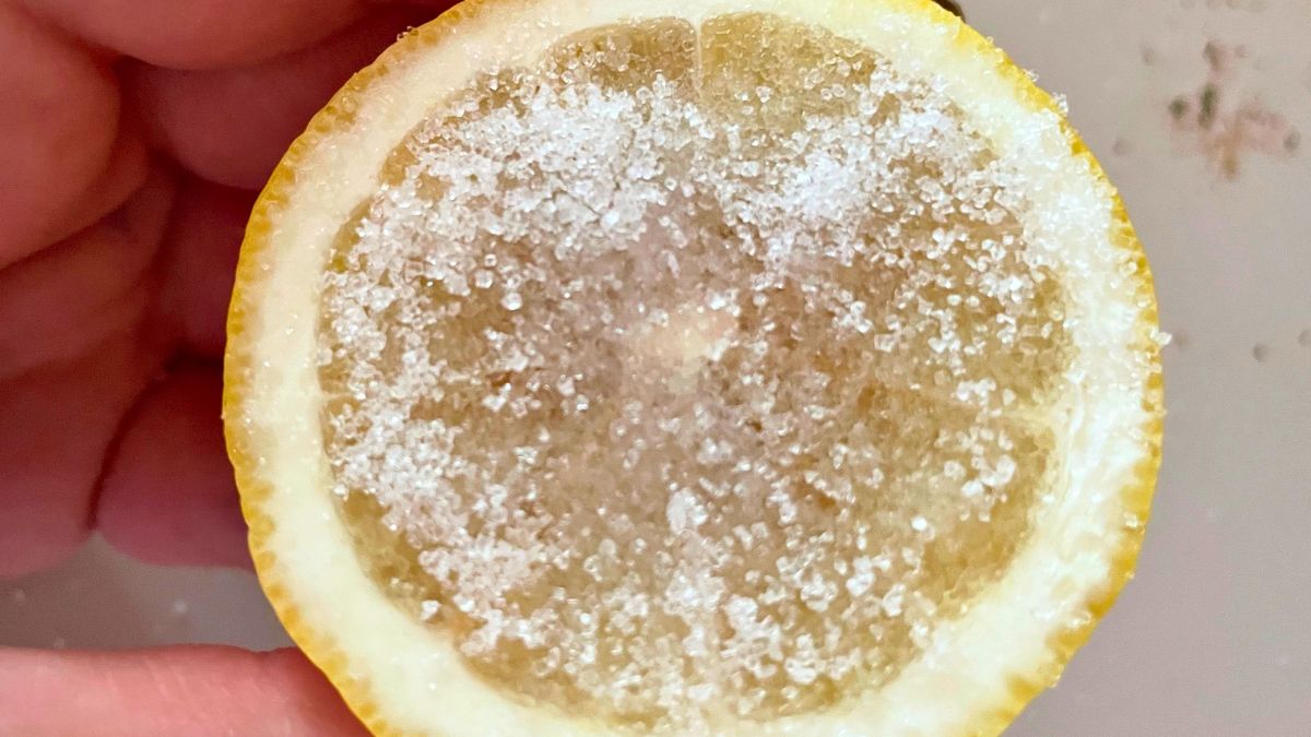 Half of a Lemon Sprinkled With Sugar and Salt