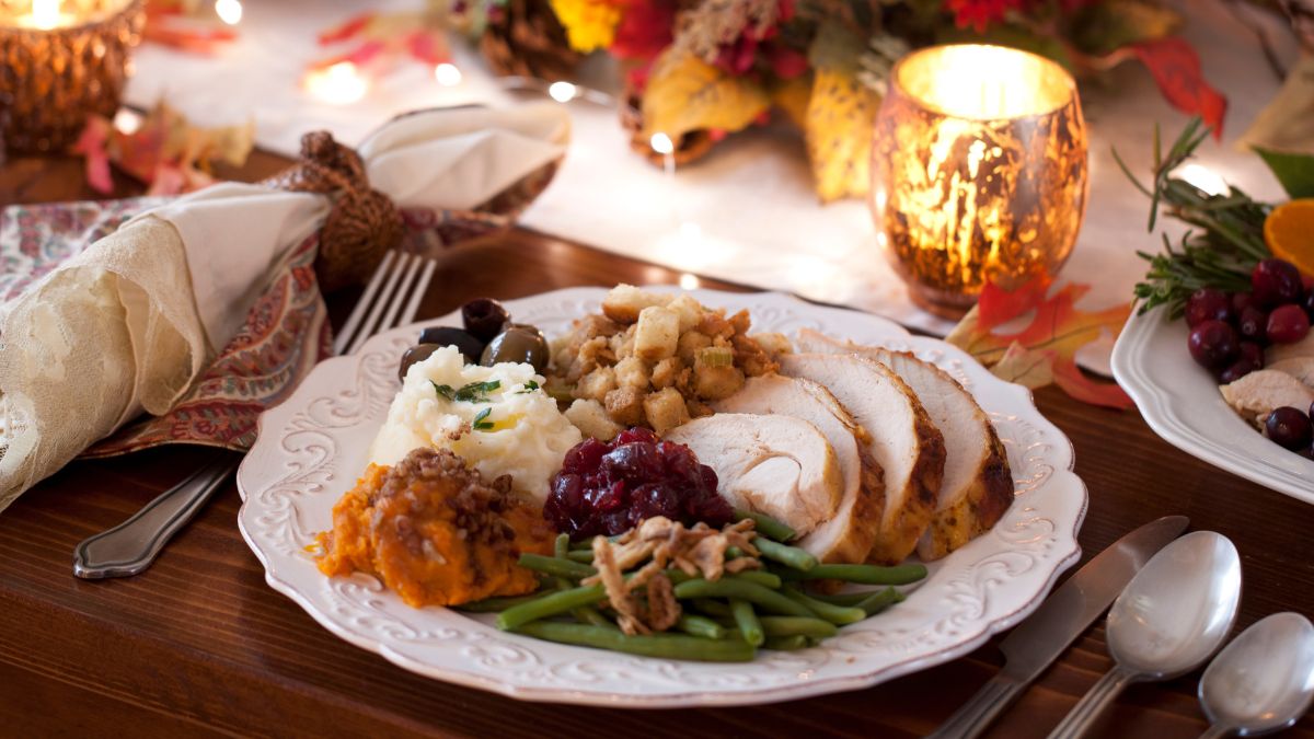 HoneyBaked Roasted Turkey Served With Green Beans, Cranberry Sauce, Mashed Potatoes, and Stuffing