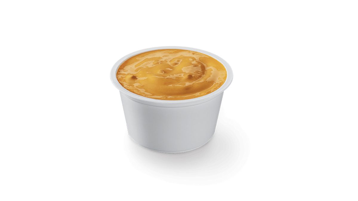 Little Caesars Caesar Dip Cheesy Jalapeno in a Plastic Dish on White Background