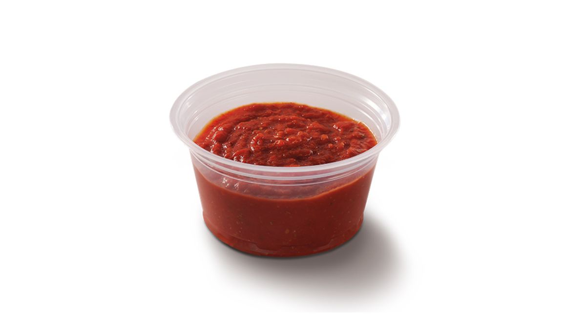 Little Caesars Crazy Sauce in a Plastic Dish on White Background