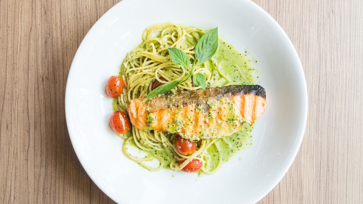 Pesto Spaghetti Served With Costco Pesto Butter Salmon and Decorated With Cherry Tomatoes