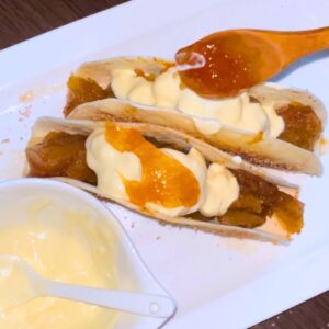 Pumpkin Pie Tacos served on a white plate with mascarpone