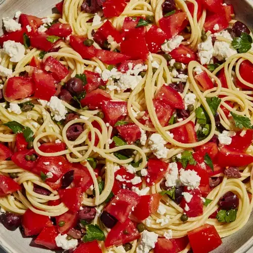 Spaghetti with tomatoes black olives garlic and feta cheese FT RECIPE0224 a706136e26f0454cb8de5e3e07f42edb