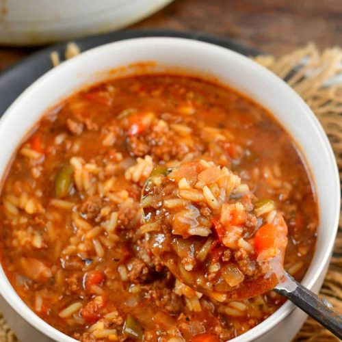 Stuffed pepper soup scooping from a bowl