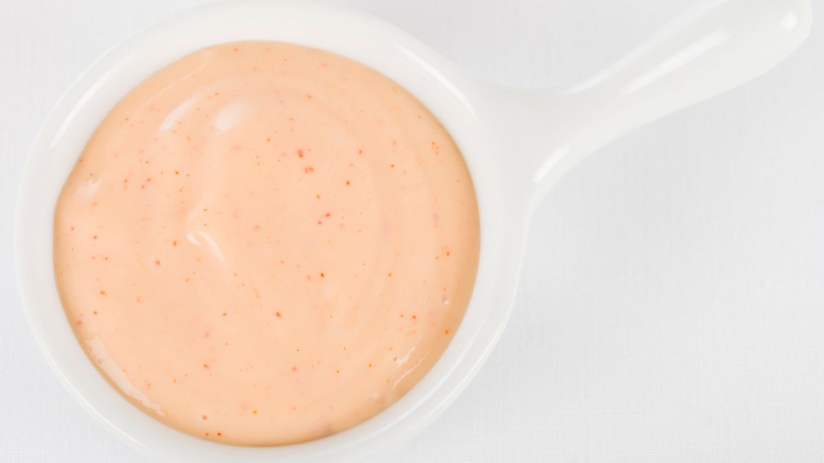 pink Panera Signature Sauce in white sauce dish on white background