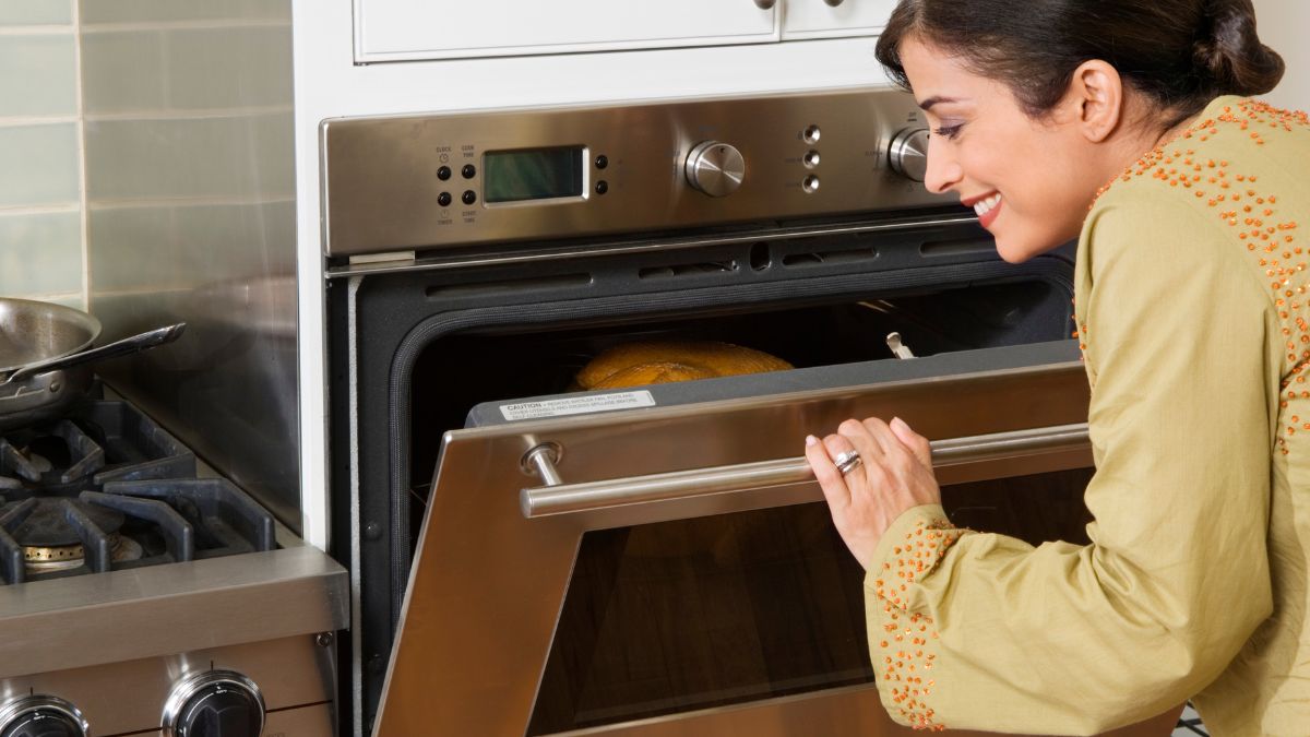 Woman Checking Butterball Turkey in the Oven