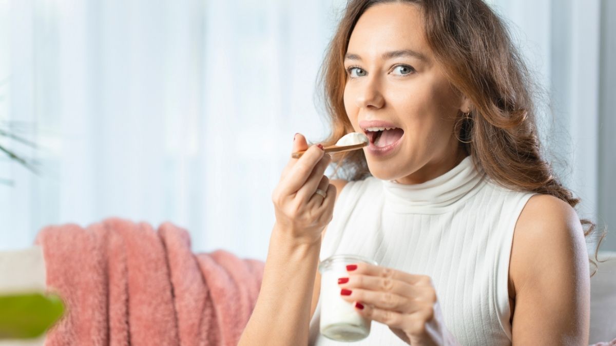 Women eating healthy yogurt
