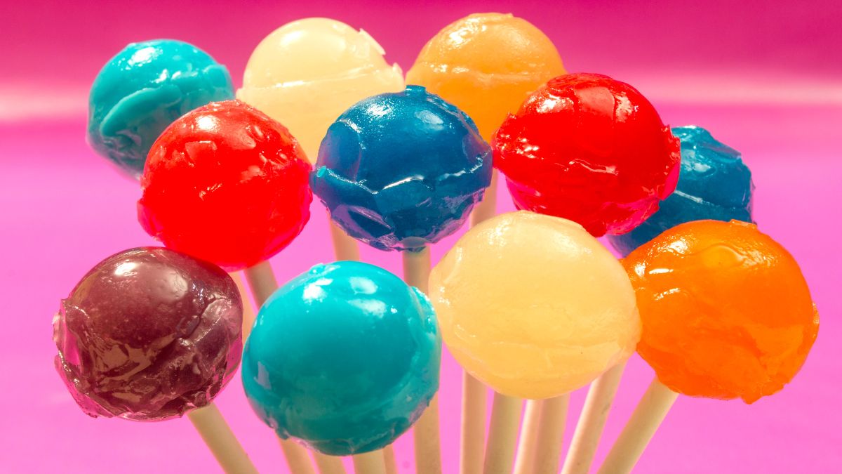 candy lollipops on pink background