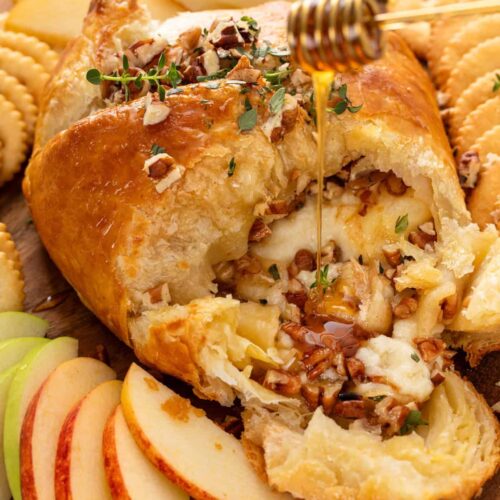 drizzling honey over baked brie