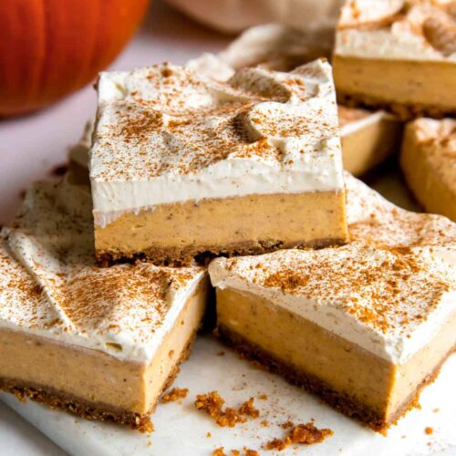 pumpkin cheesecake bars with whipped cream