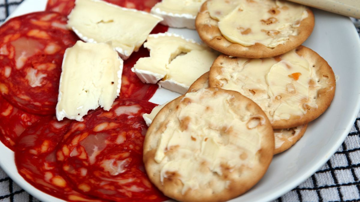 salami and brie on water crackers